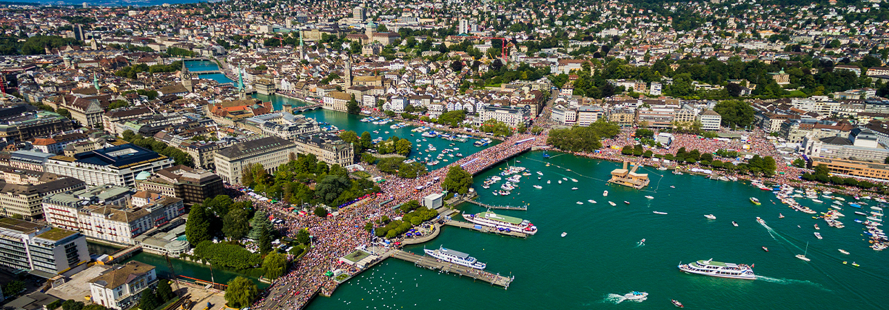 People joyfully dancing at the Zurich Street Parade